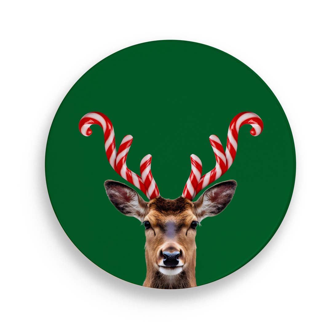 sottopentola in porcellana e sughero color verde con fantasia cervo con le corna bianche  e rosse ad evocare le stecche natalizie di zucchero